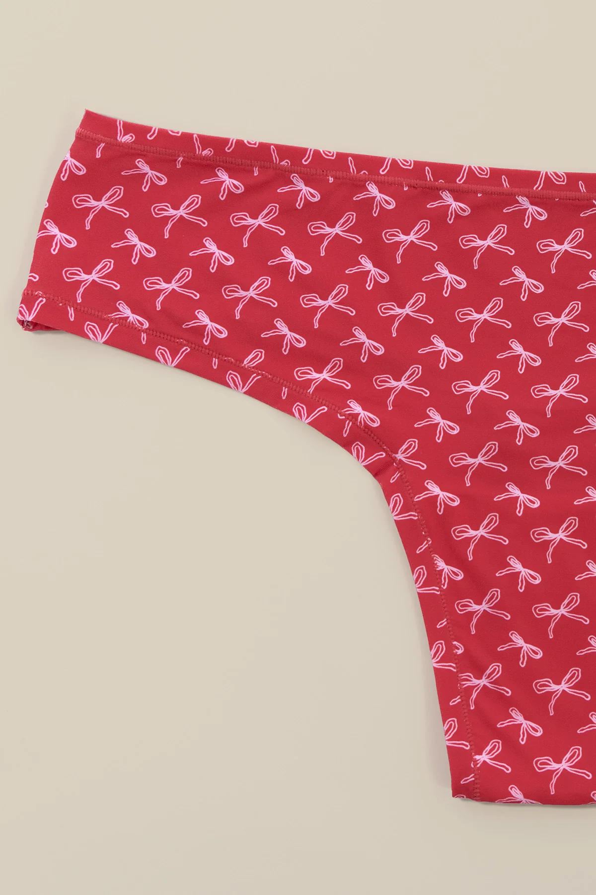 11101-next-to-nothing-thong-panty-demure-bows-1.webp