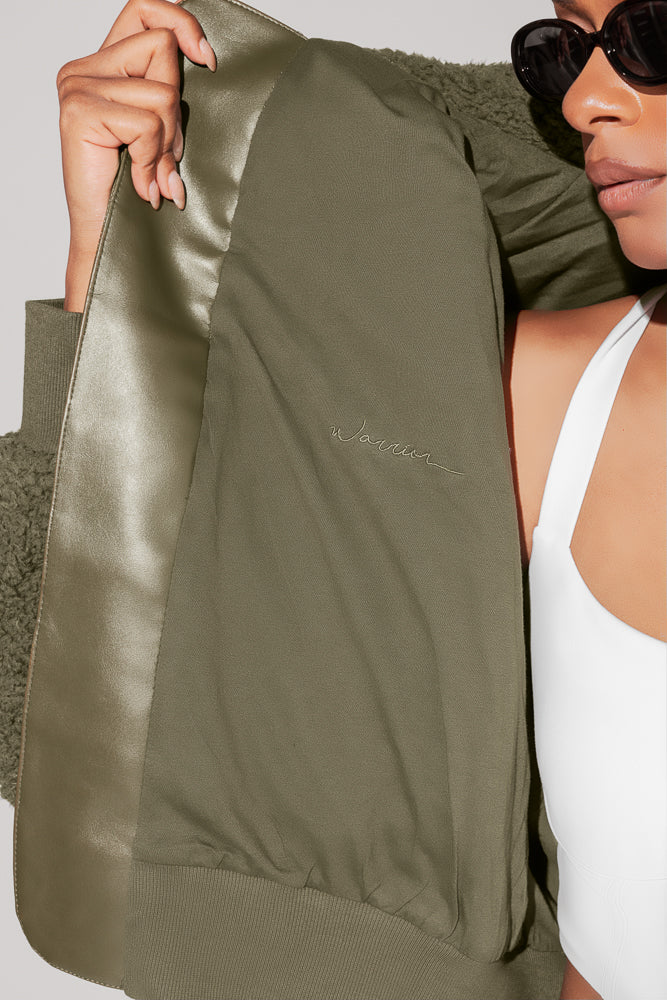 12100-the-kinsley-bomber-jacket-in-faux-sherpa-olive-1.webp