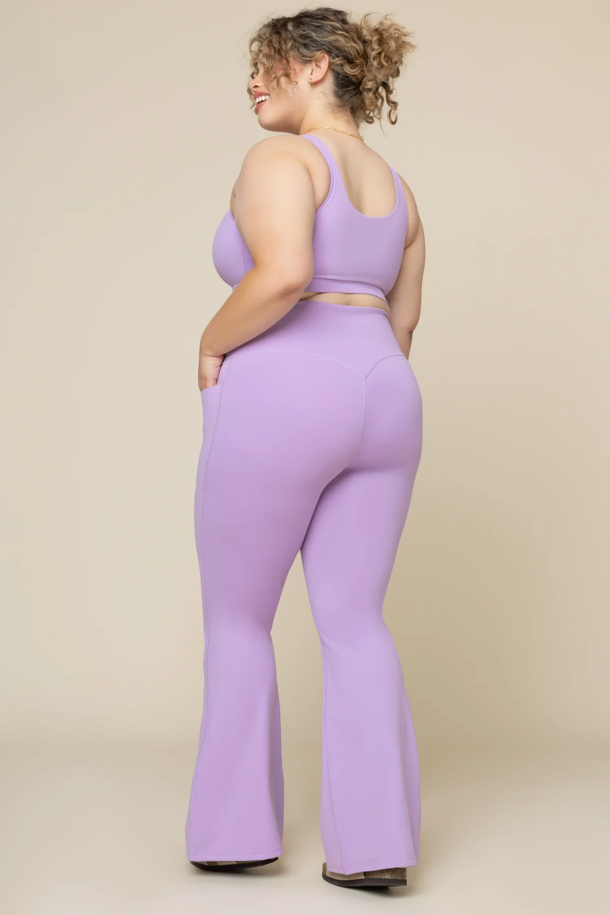5933-crisscross-hourglass-flared-leggings-with-pockets-mystic-purple-1.webp