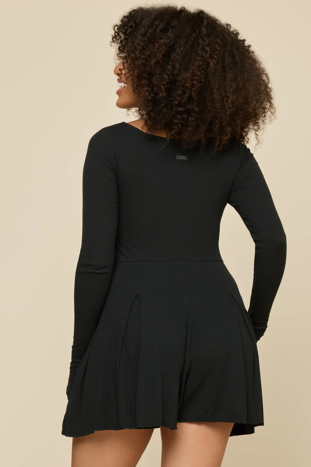 7890-go-with-the-flow-long-sleeve-romper-black-1.webp