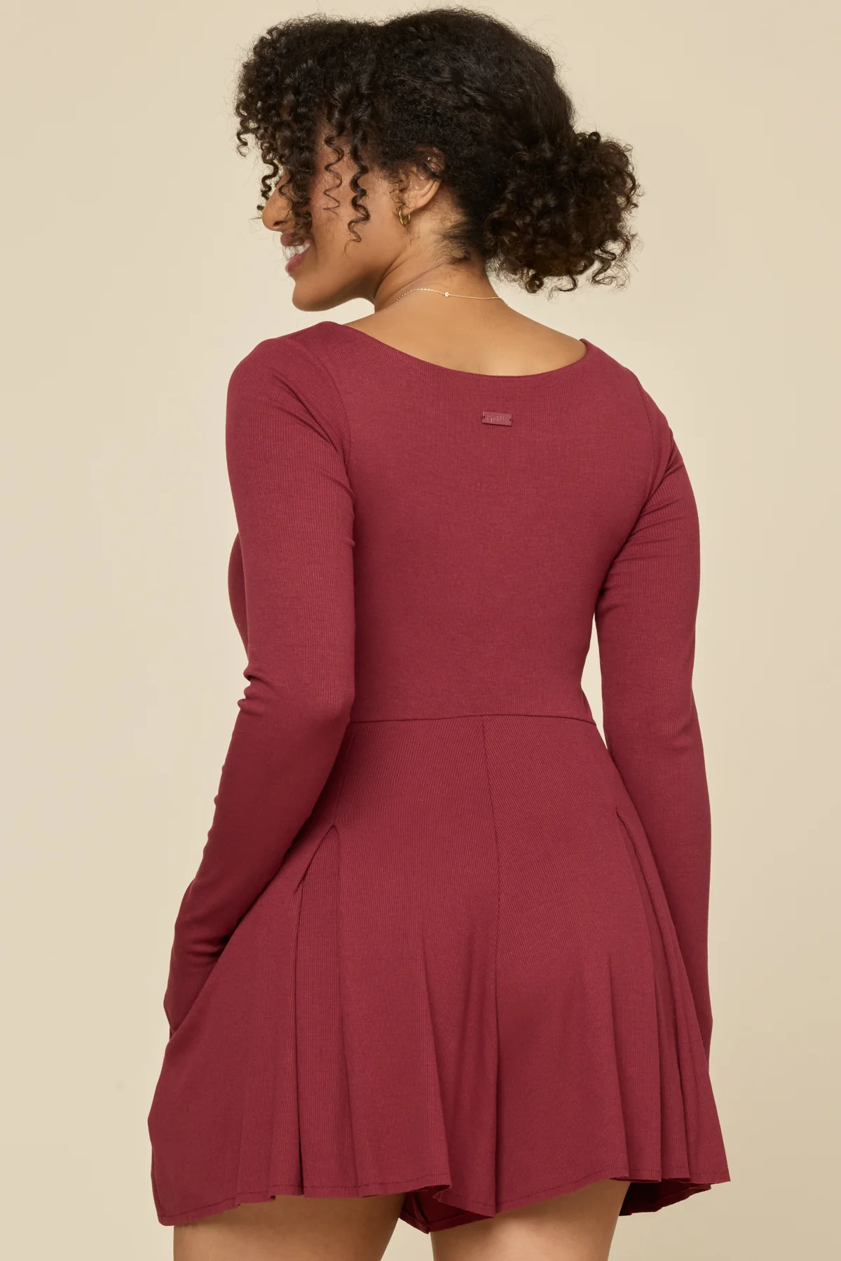 8431-go-with-the-flow-long-sleeve-romper-crimson-1.webp